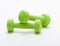 Small green dumbbells, isolated in white