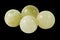 Small greenish onyx balls macro isolated