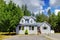 Small grey American house near the forest.