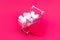 Small grocery cart full of sweet marshmallow candies. Give gifts with love on Valentine`s Day and birthday. Online