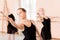 Small group of teenage girls practicing classical ballet