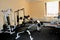 Small gym room with exercise equipments. House interior