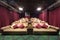 Small hall of cinema with soft couches with pillows