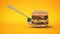 A small hamburger stuck in the fork. The concept of adequate nutrition.