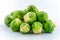 Small heap of brussels sprouts on white background