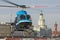 Small helicopter takes off from the helipad in Saint-Petersburg, against the backdrop of the Kunstkamera, the arrow of the Vasilye