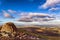 A small hilltop cairn overlooking rural farmland and hills Carn Pica, Brecon Beacons