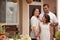 Small Hispanic Family in Front of Their Home