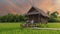 small homestay at the farm with green rice paddy field in Central Thailand at sunset