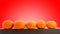 Small honey tangerines shot over red background