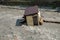 A small house destroyed the mudflow in the mountains. A small house was washed away by a flooded mountain river