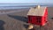 Small house model on ocean beach sand