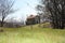 Small house in the mountains abandoned in a large green clearing on the Apuan Alps in Tuscany, Tuscan Apennines