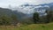 Small house in rural area between mountains surrounded by clouds. Ecuador landscape