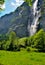 Small house under a Swiss waterfall