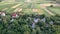 Small houses. Green fields. Aerial view of the village