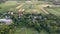 Small houses. Green fields. Aerial view of the village