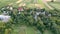 Small houses. Green fields. Aerial view of the village