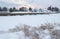 Small houses by a small river. Winter cozy rural landscape.USA. Maine.