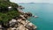 Small houses on tropical island. Tiny cozy bungalows located on shore of Koh Samui Island near calm sea on sunny day in Thailand.