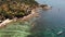 Small houses on tropical island. Tiny cozy bungalows located on shore of Koh Tao Island near calm sea on sunny day in Thailand