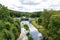 A small hydropower plant on a small river in Central Europe. A barrier with turbines for generating electricity