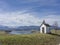 Small idyllic meadow chapel near lake Rieg