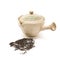 Small individual ceramic teapot and scattered tea