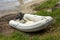 A small inflatable dinghy on a beach