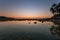 Small island with beautiful light sunset or sunrise over sea and beautiful reflexion in the water