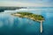 A small island with hotels in the Adriatic Sea near the ancient city of Porec in Croatia. Shooting from a drone.