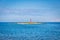 A small island with a lighthouse near Porec town.