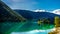 Small island in the middle of the crystal clear waters of Pavilion Lake in Marble Canyon Provincial Park, British Columbia