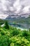 Small islands with pine-trees in the middle of Eibsee lake with Zugspitze mountain. Beautiful landscape scenery with paradise