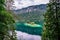 Small islands with pine-trees in the middle of Eibsee lake with Zugspitze mountain. Beautiful landscape scenery with paradise