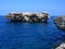 Small islet along the coast of Dwejra, Gozo, located in Maltese islands during daylight