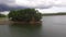 Small islet on the lake hydro electric dam reservoir.