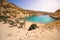 The small isolated gulf of Vathi, in Crete, with sandy beach and some lucky campers.