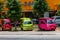 small Japanese trucks converted into taxis for tourists called tuk tuk in Thailand on the island of Phuket. Multi-colored cars on