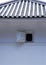 A small Japanese window details with blue tiled roof
