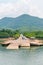 Small jetty for ferry on green tropical island