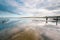 Small jetty with harbor along the coastline of the wadden island of Texel