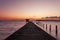 Small jetty in to the sea in Long exposure image of dramatic sunset or sunrise,sky and clouds over tropical sea scenery landscape