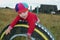 Small joyful girl on a wheel in village