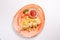 Small kid`s meal. A plate of chicken barbecue with french fries, cherry tomato, ketchup on a white background. Top view children