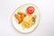 Small kid`s meal. A plate of chicken nuggets with french fries with ketchup on a white background. Top view children`s menu food