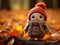 a small knitted bird is standing in the fall leaves