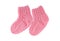 Small knitted pink socks on a white background