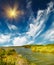 Small lake and blue sky by autumn.