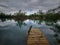 A small lake with capacity for bathing under the heavy skies looks gloomy